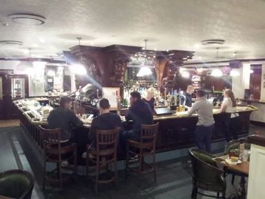 The square bar dominates the centre of this underground cavern.