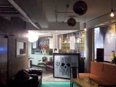 The bar and hair salon really do merge in the middle.