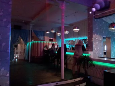 This is probably the first place we've been to where the bar is lined with little palm trees!