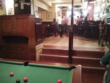 The crowd shifted toward the front of the pub as soon as the karaoke machine fired up.