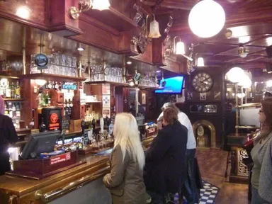 Stick with a pint. You're not going to find much of interest in the fridge.