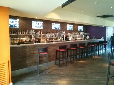 The bar. Those are a lot of TVs.