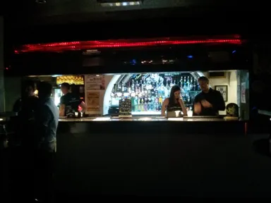 The bar is the only source of light here.