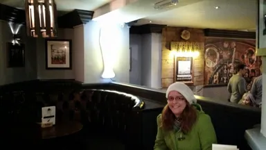 Emily is happy. She has just perused the beer menu.